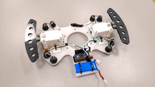Paddles and buttons on a frame with wireless transceiver